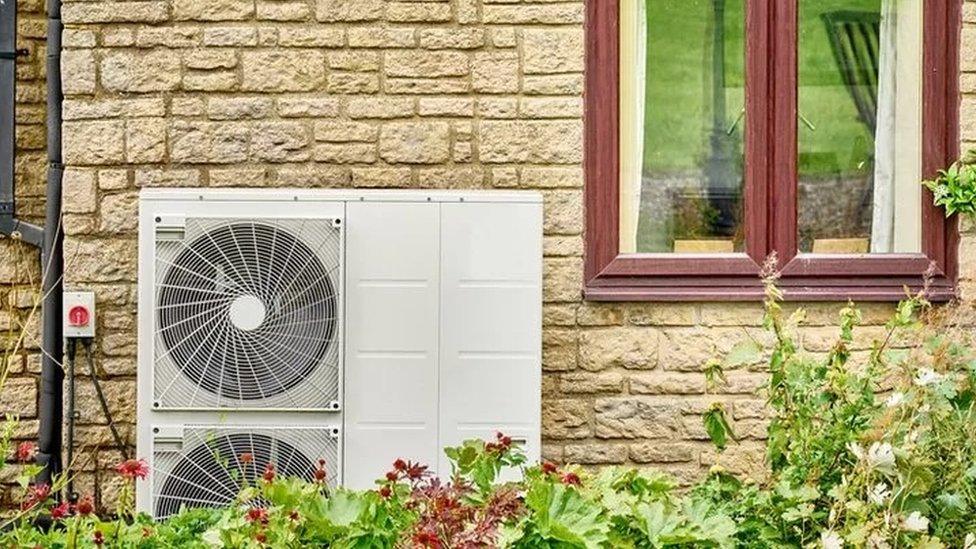 A heat pump outside a house