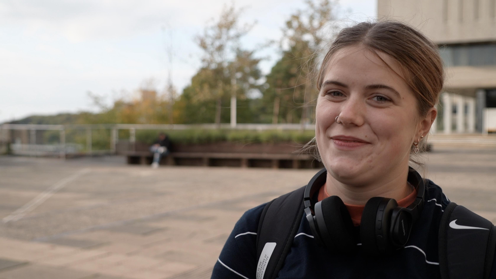 Amy with Aber campus in the background