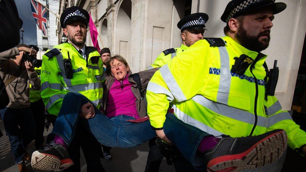 Police removing a protester