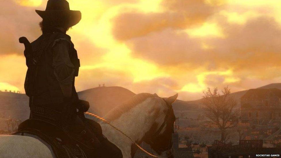 John Marston overlooks a town in Red Dead Redemption