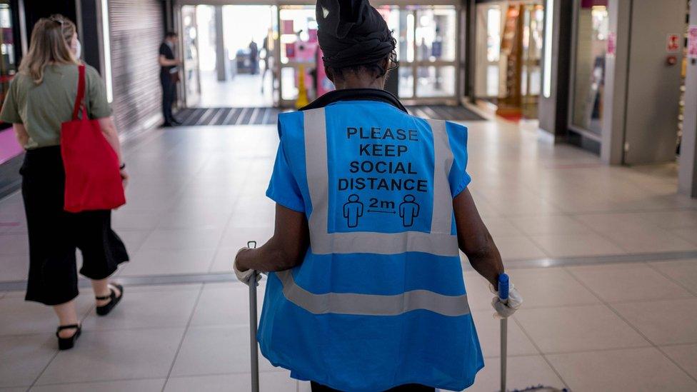 A sign on a hi-vis jacket of a worker in Walthamstow, London