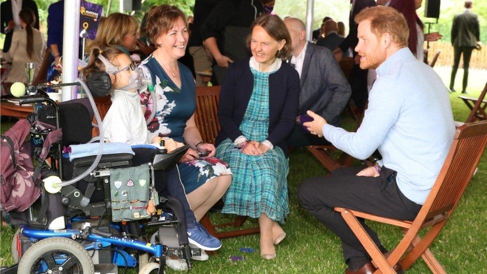 Prince Harry and an award winner