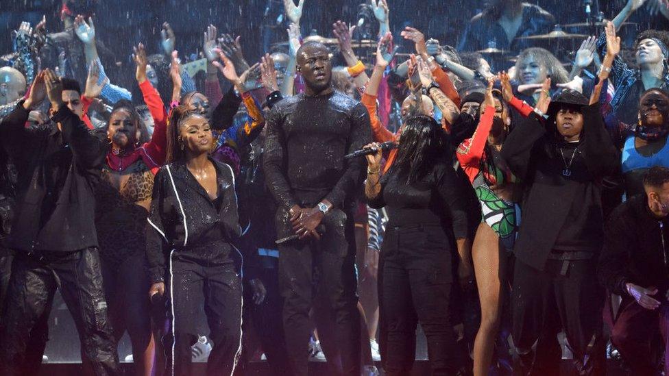 Stormzy-on-stage-looking-very-wet.