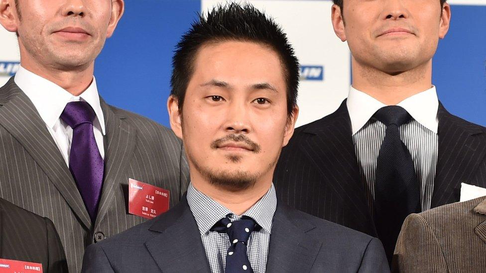 Tsuta's representative Yuki Onishi (front C) poses at a photo session during the Michelin Guide Tokyo 2016 publication announcement ceremony in Tokyo on 1 December 2015