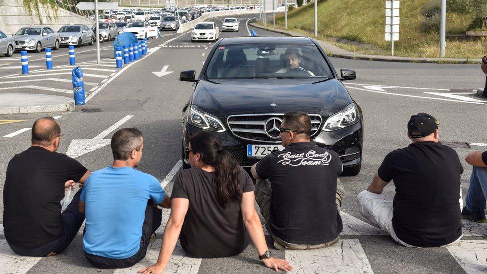 Taxi drivers block the access to airport in Bilbao, Basque Country, northern 30 July 2018.