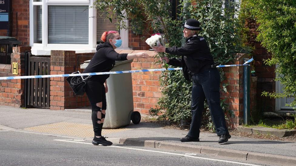 Floral tributes being left at the scene