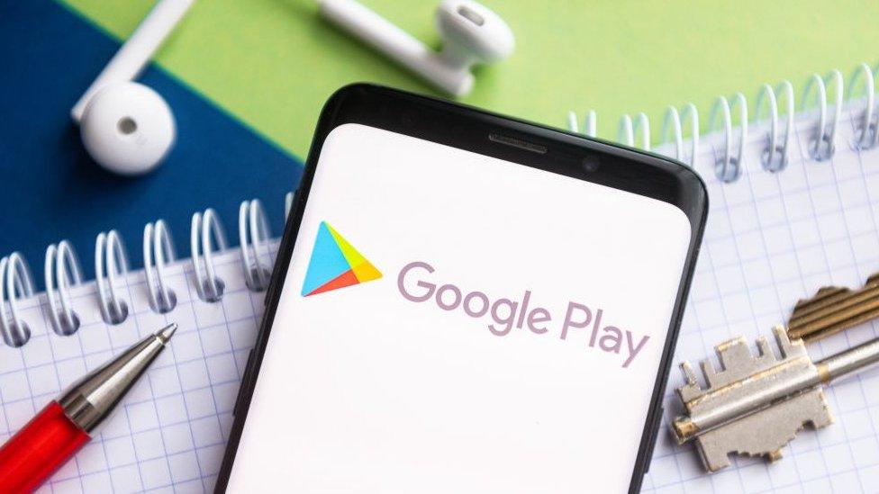 Google Play logo in phone