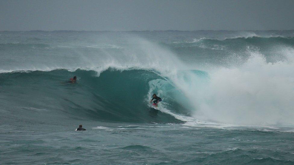 Jo Morris surfing