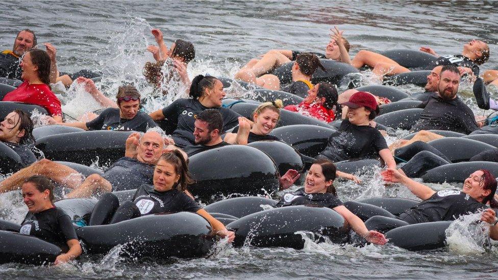 Competitors taking part in the snake race