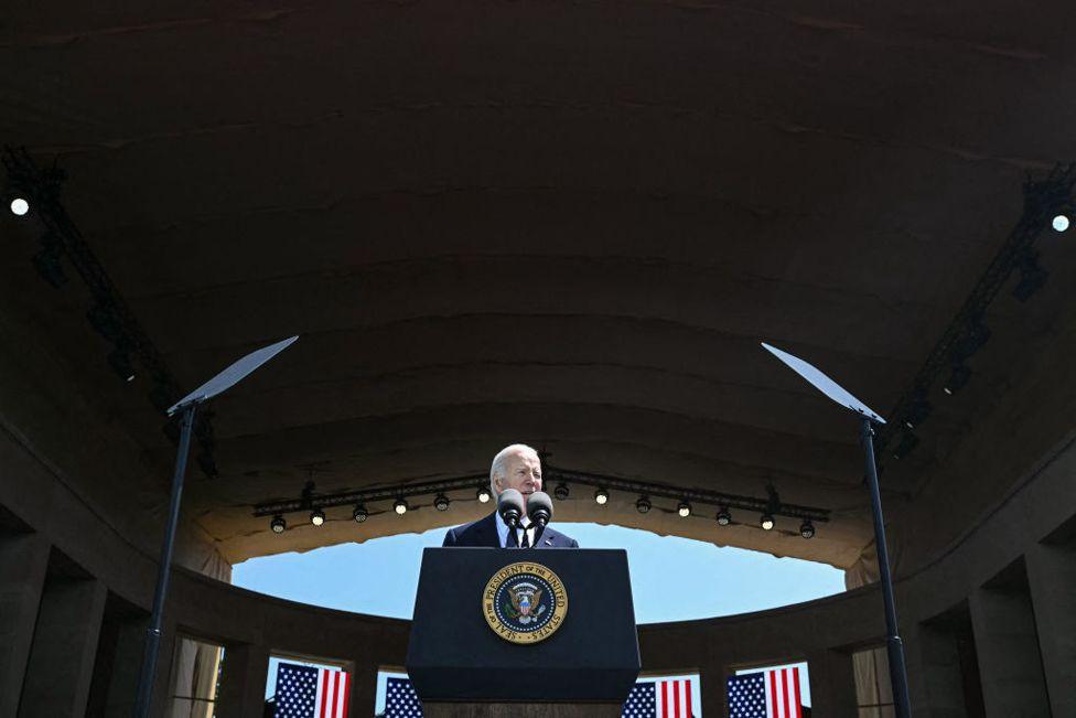 US President Joe Biden delivers a speech, as US WWII veterans look on during the US ceremony marking the 80th anniversary of the World War II "D-Day" Allied landings in Normandy, at the Normandy American Cemetery and Memorial in Colleville-sur-Mer, which overlooks Omaha Beach in northwestern France, on June 6, 2024. 