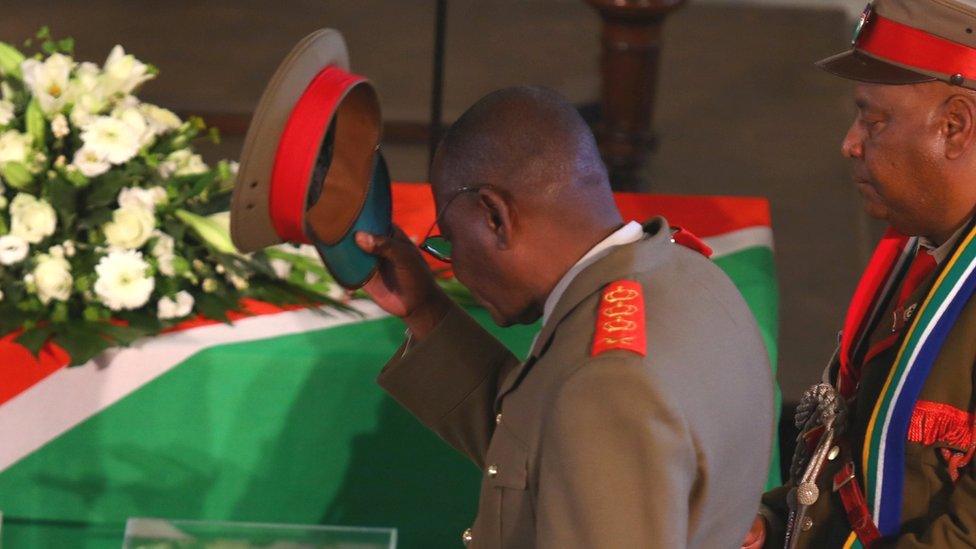 Members of a Namibian delegation attend a ceremony in Berlin, Germany, for the returning of human remains