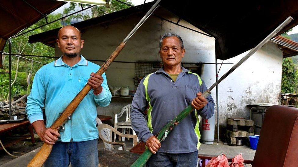 Tama Talum, right, with his neighbour