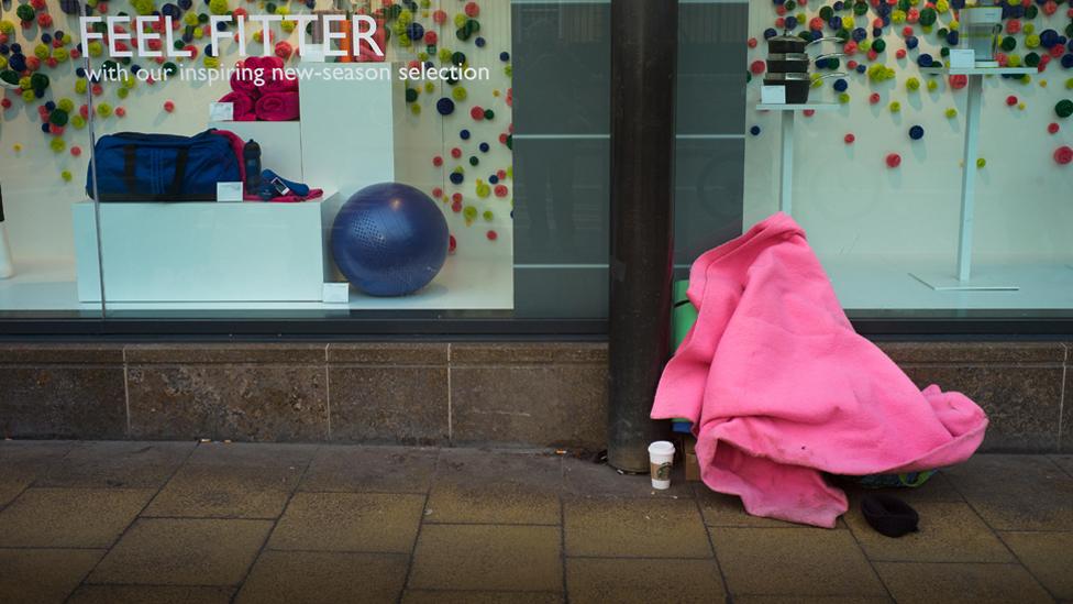 Homeless person outside John Lewis in Cambridge