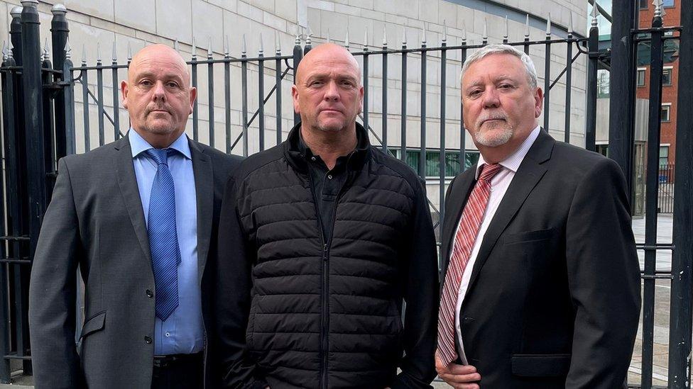 Kieran, Joseph and Jim Geddis outside Laganside courts in Belfast