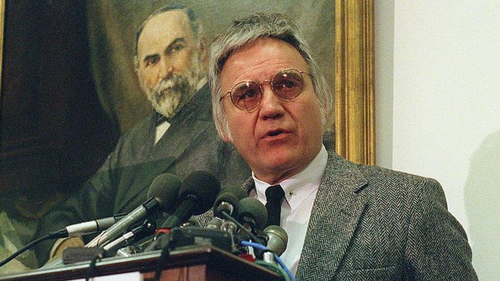 Jim Traficant at a podium in front of a painting