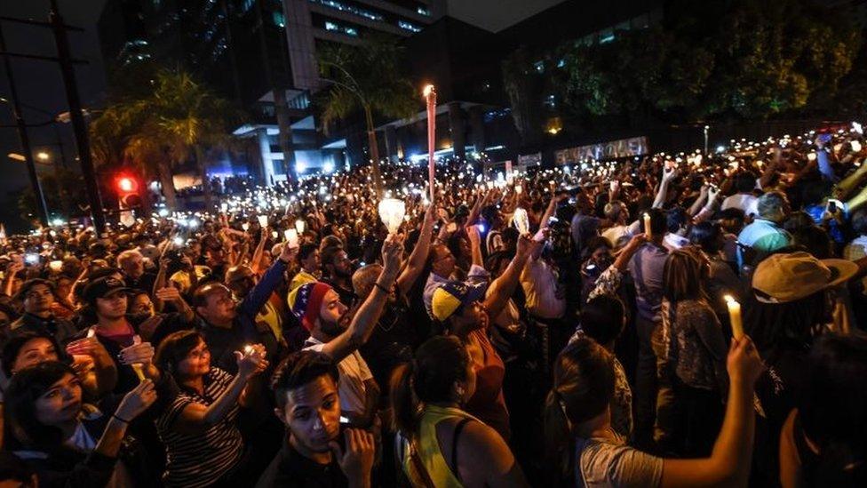 Opposition activists stage a protest rally in Caracas. Photo: 17 May 2017