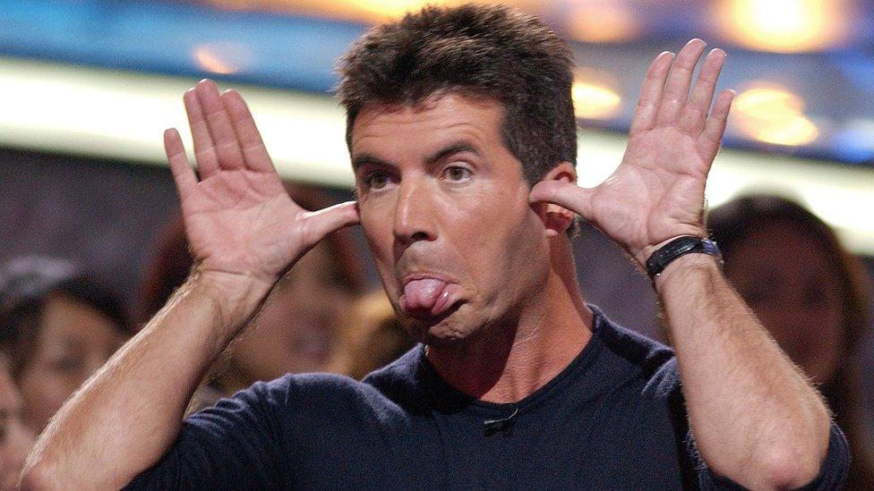 Simon Cowell sticking his tongue out