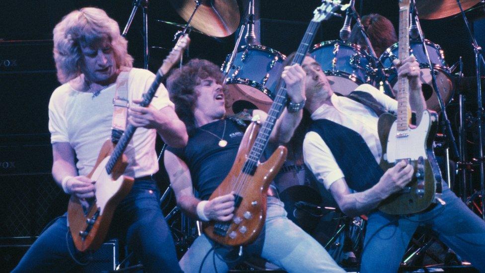 Rick Parfitt (left) and Status Quo in 1984