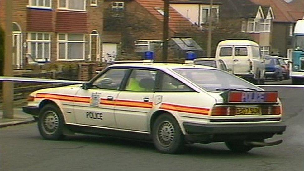 A police car at the scene of Gerard Hoarau's murder in Edgware in London