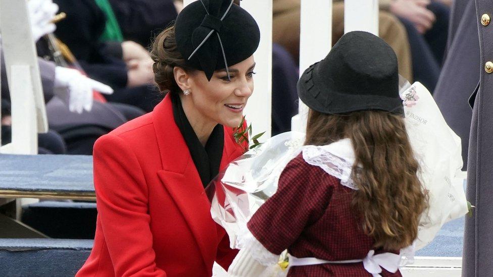 The Princess of Wales (left) receives a bunch of flowers during a St David's Day visit to the 1st Battalion Welsh Guards at Combermere Barracks in Windsor, Berkshire