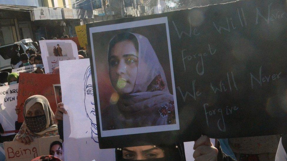 Supporters of Baloch political activist Karima Baloch hold her pictures during a rally to mourn her killing, in Quetta, the provincial capital of Balochistan province, Pakistan, 23 December 2020.