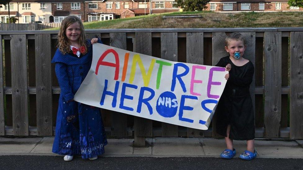 boy-and-girl-with-sign.