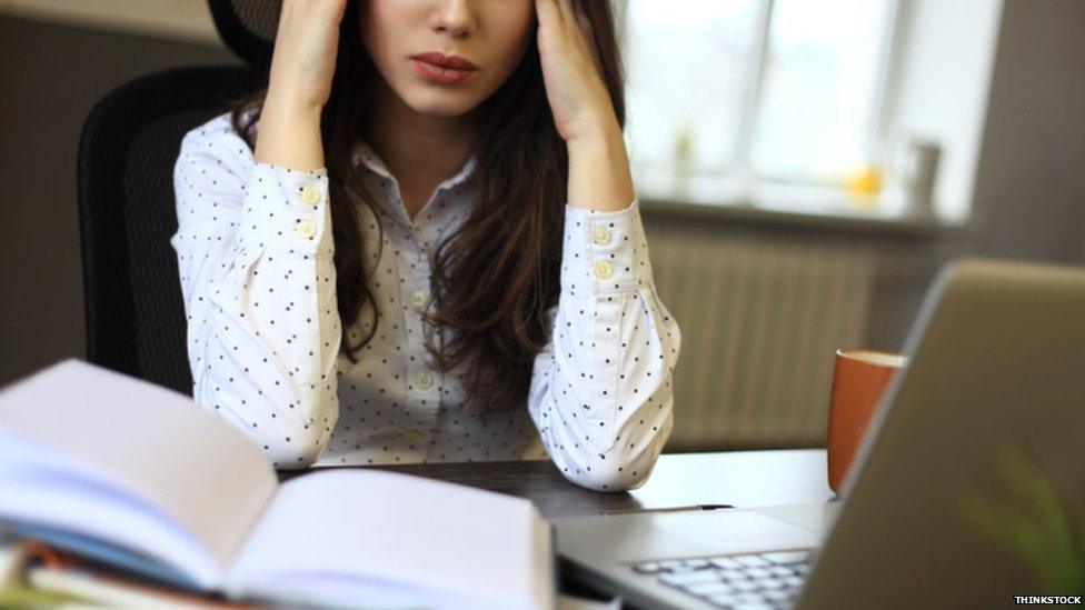 File photo of a teacher at her desk.