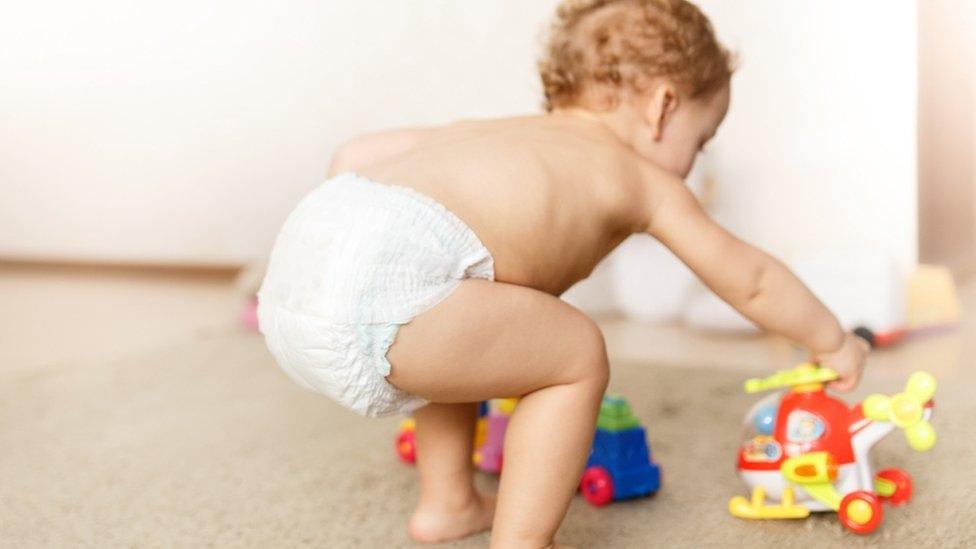 Toddler playing with toys