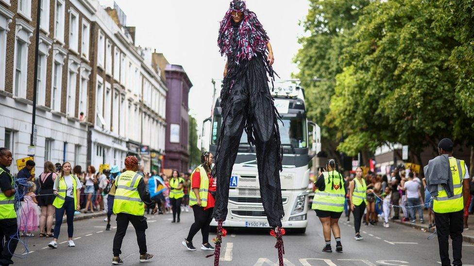 Person on stilts at Notting Hill Carnival