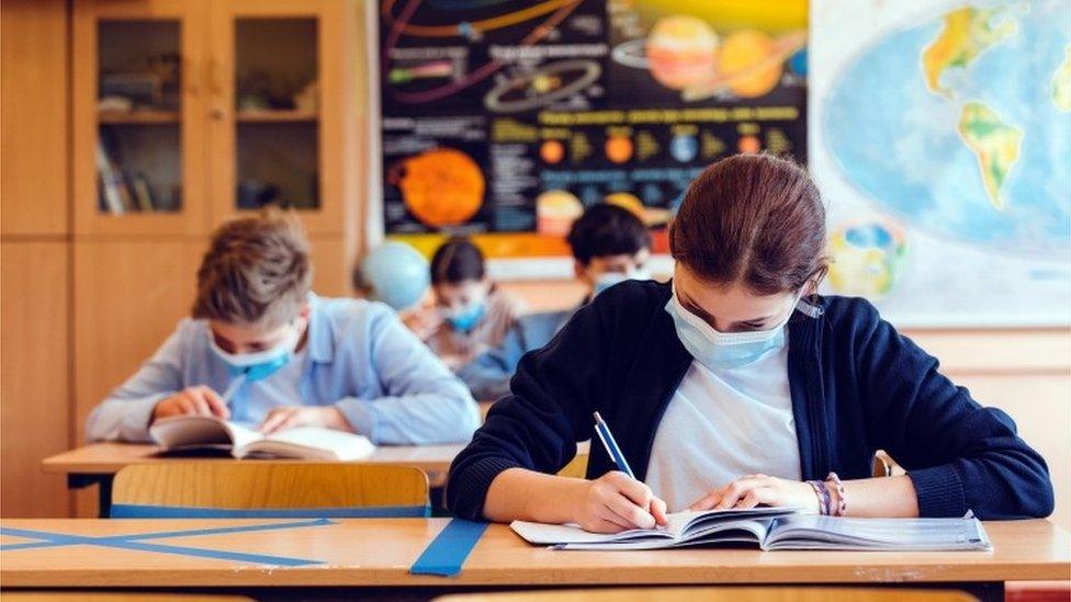 School pupils wearing masks while at their desks