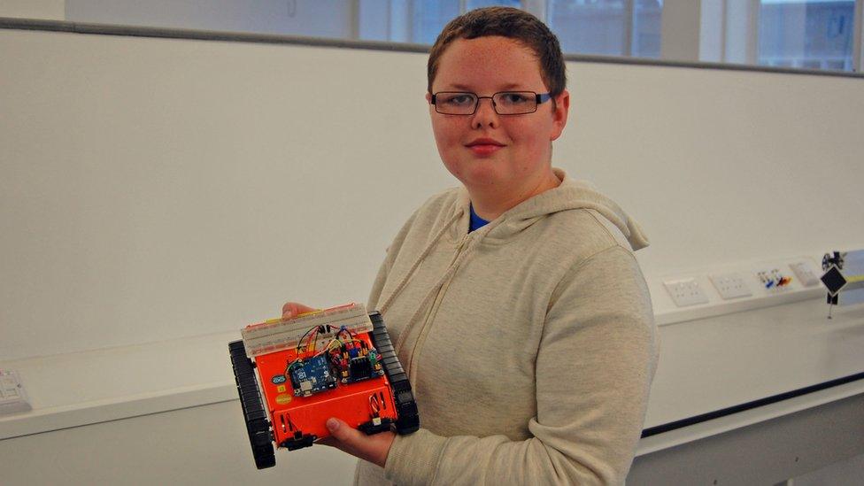 Aberystwyth Robotics club member Owen with the Crawlerbot