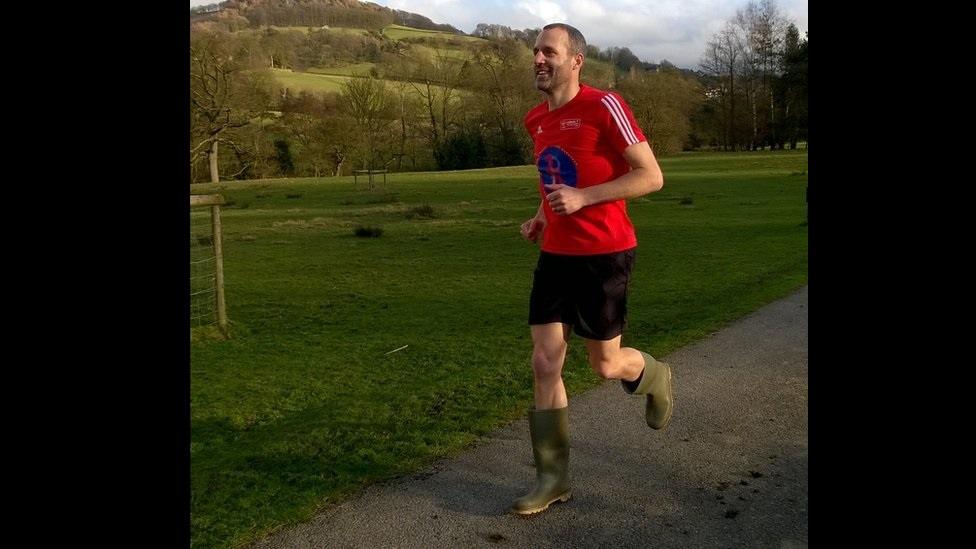 Runner in Wellington boots