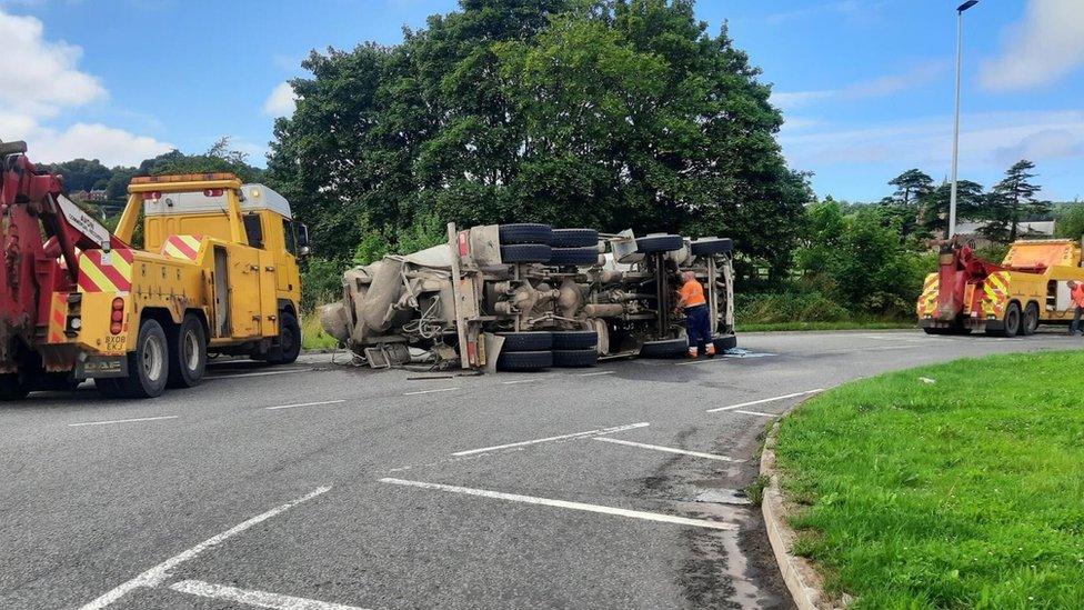 Overturned lorry on road