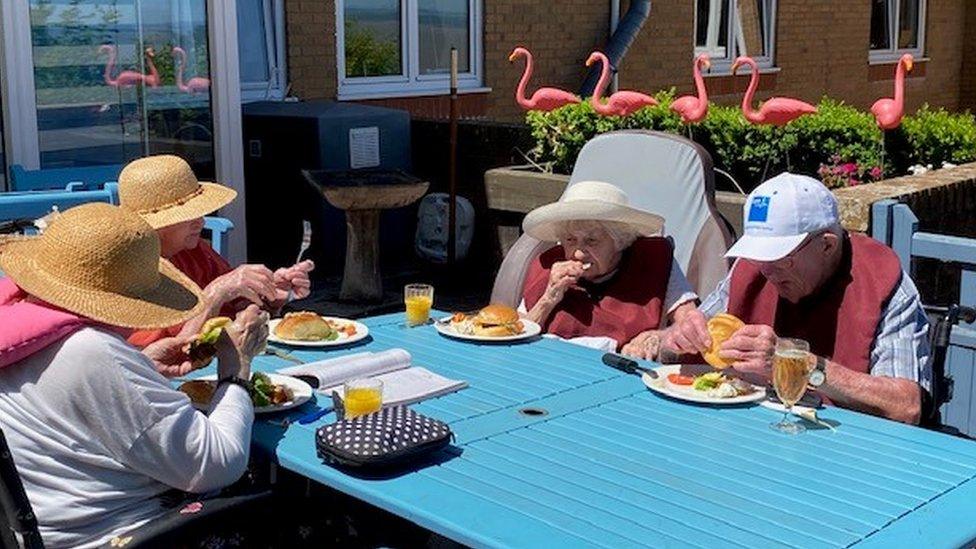 Residents with the flamingos