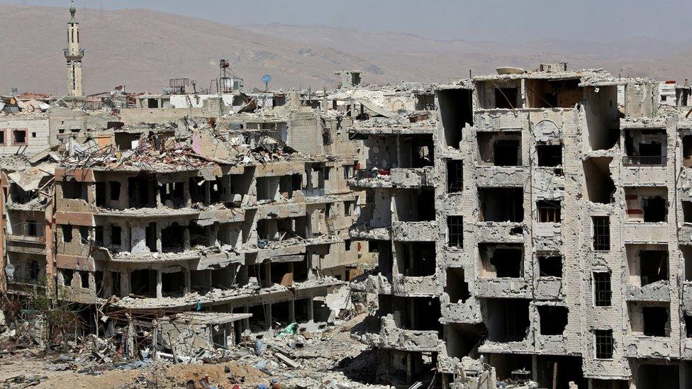 Destroyed buildings in Harasta, in the Eastern Ghouta, after government forces forces retook the town from the rebels (29 March 2018)