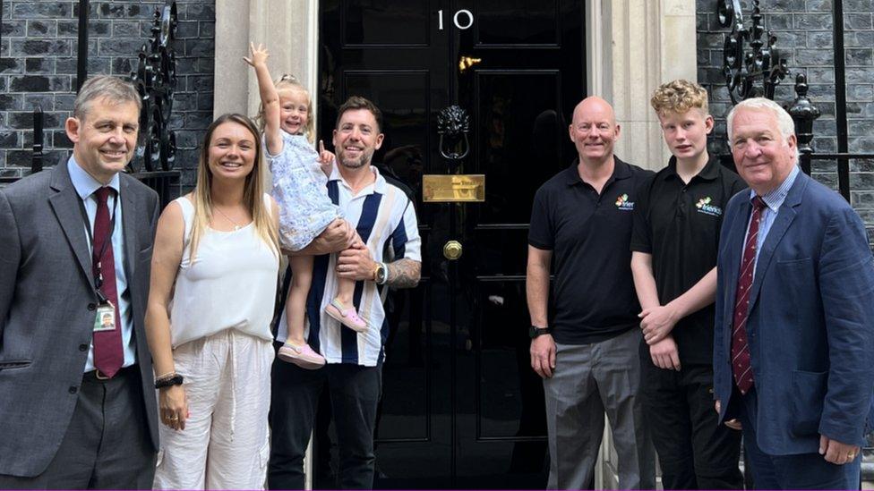 Jon Mole with Alex, Lexi and Dave Robins, with Chris Bedford-Gay, his son Oliver and Sir Mike Penning