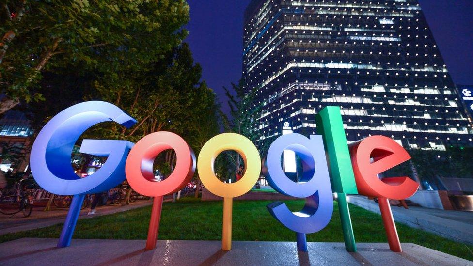 The Google Inc. logo is illuminated in front of Google Beijing Office