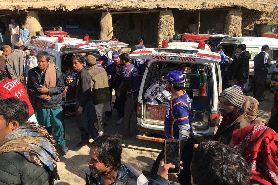 Rescue workers shift the bodies of the victims after 11 Shia minority people were killed by unknown gunmen in Mach on the outskirts of Quetta, Balochistan province, on 3 January 2021