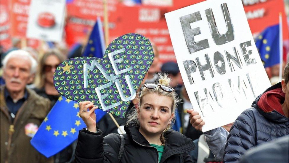 "People's Vote" campaigners carry signs on march in Liverpool