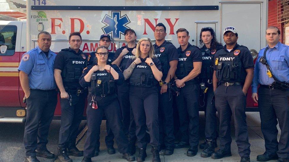 EMS crew pose in bullet-proof vests