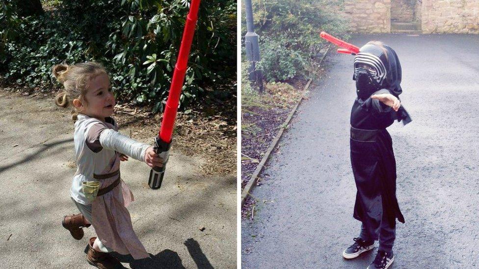 Picture from twitter of young girl dressed as Rey and Darth Vader