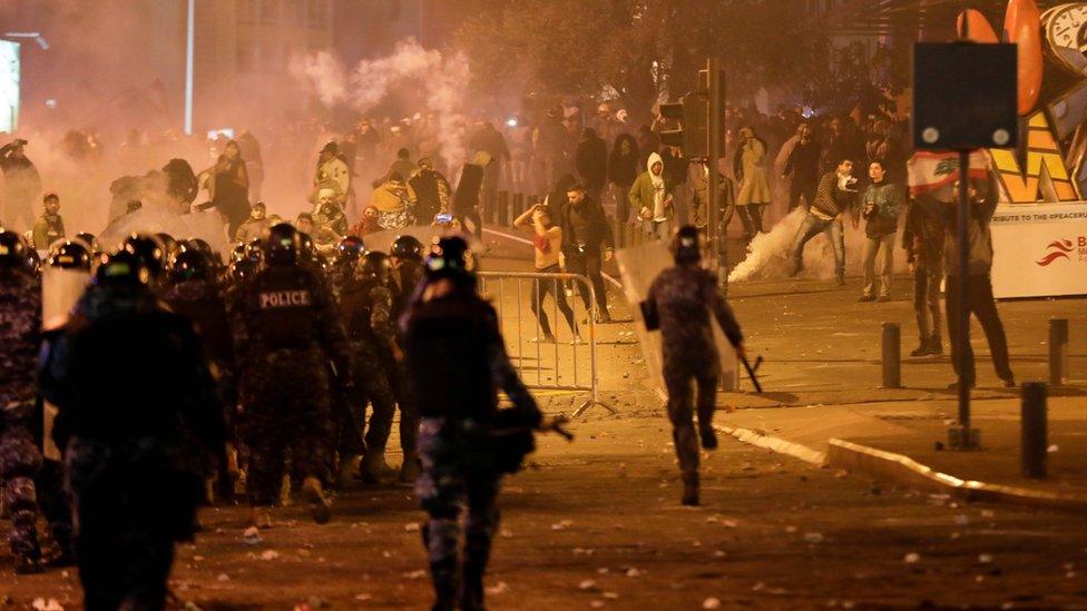 Lebanese riot police clash with anti-government demonstrators in Beirut