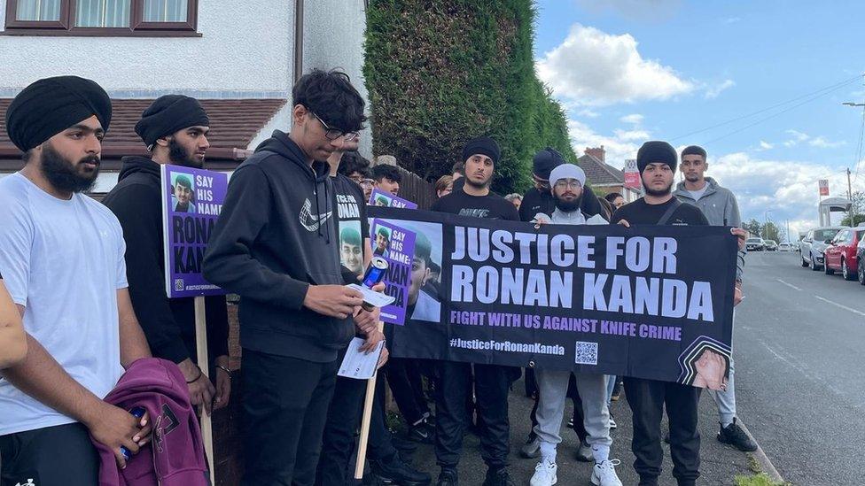 A group protesting for justice for Ronan Kanda