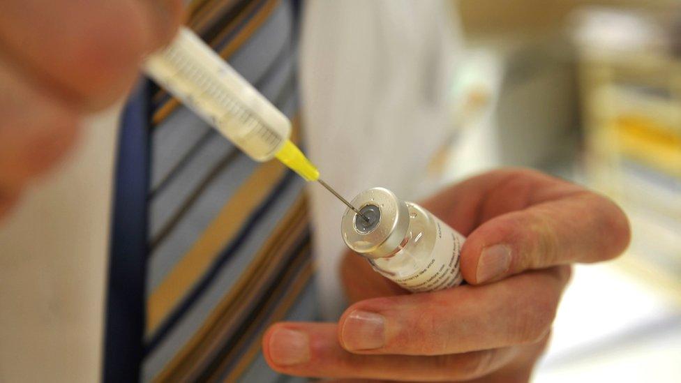 Vaccine and syringe - file pic