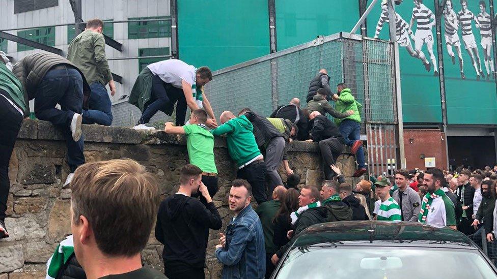 Fans climbing out of the ground