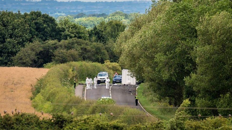 Forensic teams on a road