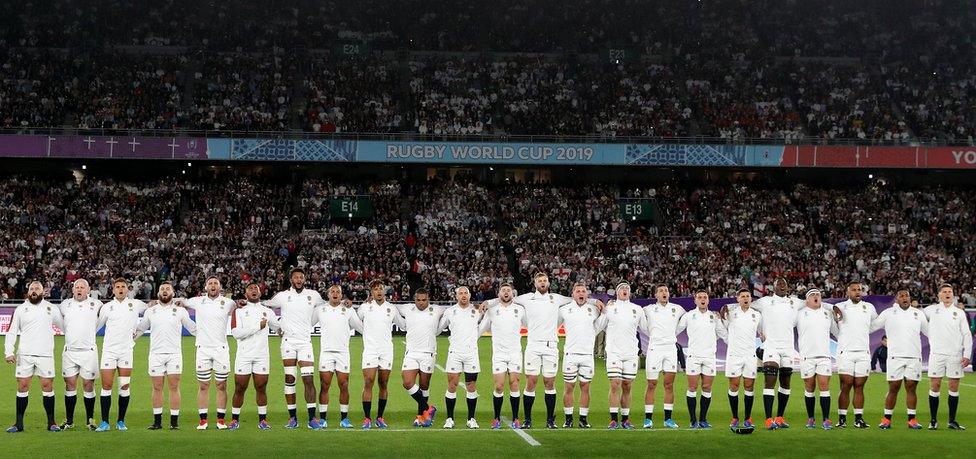 The England starting players and replacements singing the national anthem before the semi-final against New Zealand