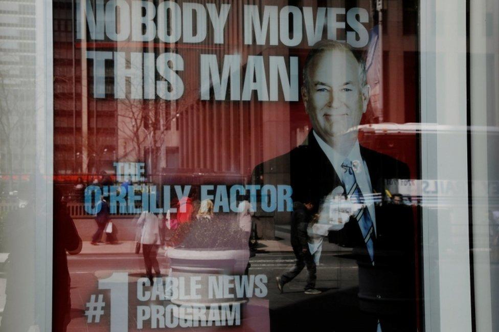 A poster for O'Reilly's show hangs outside the Fox News offices in New York City