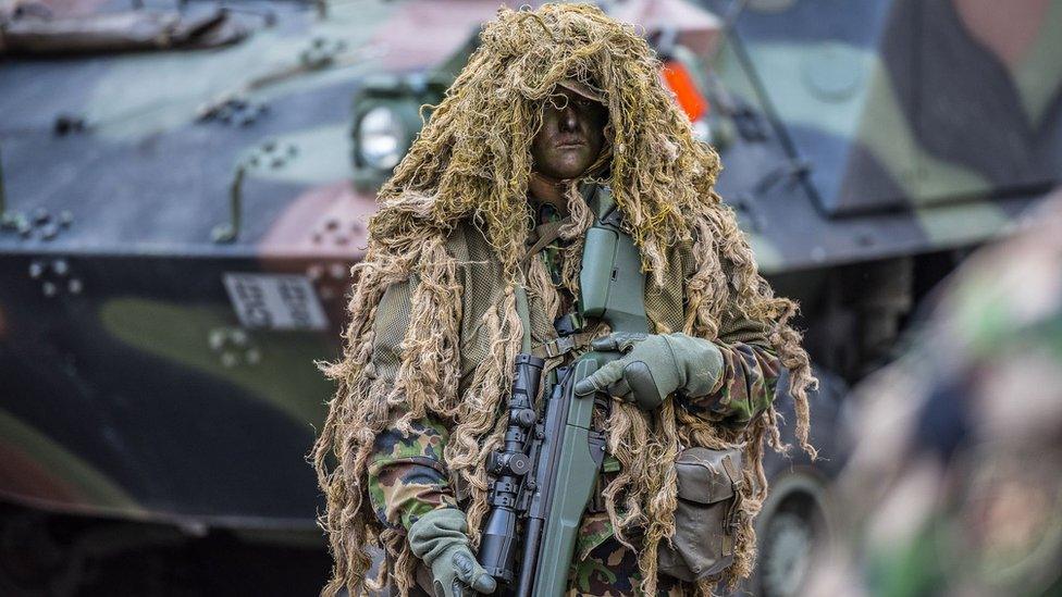 Swiss army sniper in camouflage (pic: Swiss Defence Department)