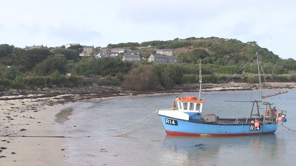 Fishing boat lies off coast